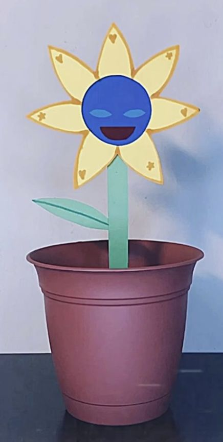 A potted smiling flower before mutation.